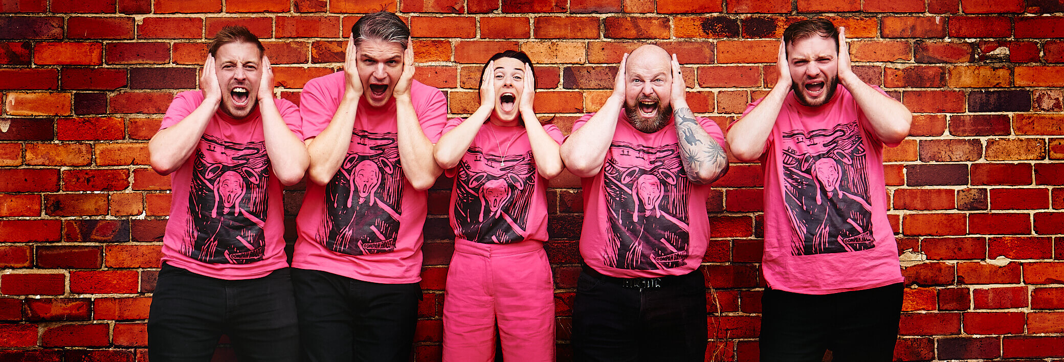 Oompah Brass - in pink t-shirts imitating Edvard Munch painting 'The Scream'